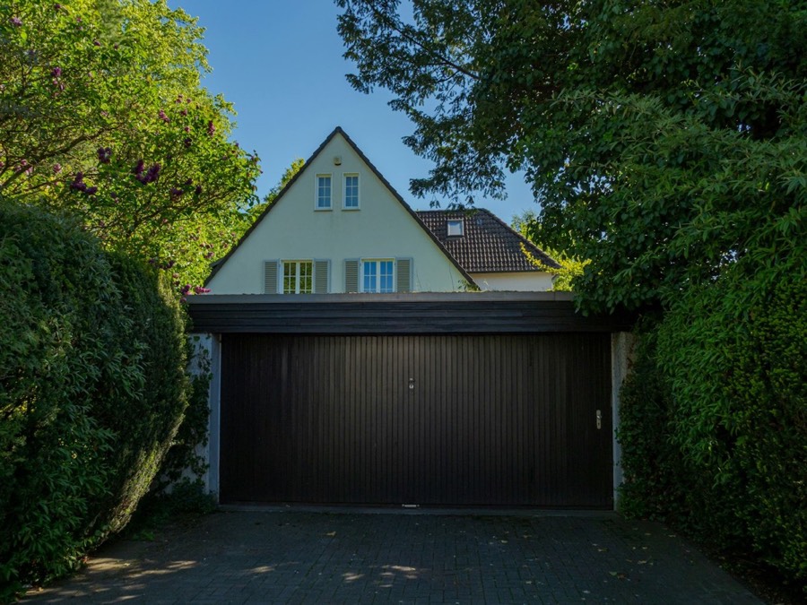 A dark sectional garage door on a house