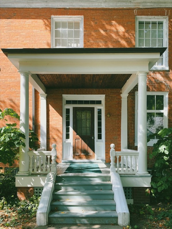 The front entrance of a brick house